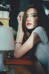 Portrait of young Asian beautiful cute girl in cafe, lifestyle concept.