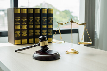 The judge's gavel at the law firm has scales, scales of justice, and litigation documents. Concepts of law and justice - obrazy, fototapety, plakaty