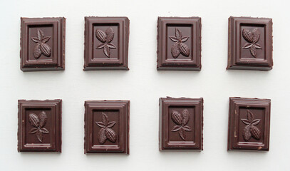 chocolate pieces on white background