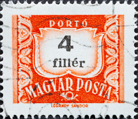 HUNGARY - CIRCA 1965: A post stamp printed in Hungary showing the number  4 on an orange postal stamp with the text filler.
