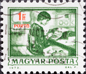 HUNGARY - CIRCA 1973: A post stamp printed in Hungary showing a person at work. Postage due - Keypunch operator