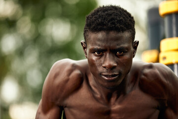 Fototapeta na wymiar Portrait of topless Afro-American sportsman ready to training.