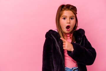 Little caucasian girl isolated on pink background