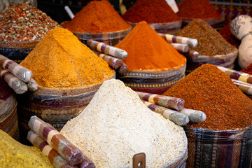 Spice and seasonings in market. Colorful spice and exotic herbs on display in spice bazaar in...