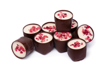 Heap of chocolate glazed sweets with fruit pieces