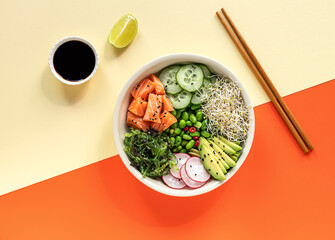 Asian trendy food, keto poke bowl with edamame beans, cucumber, salmon, avocado, and seaweed.