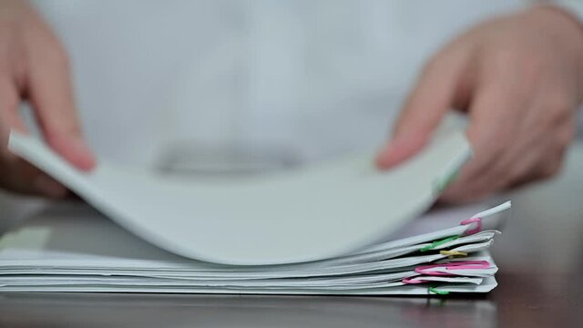 A businessman who organizes documents.