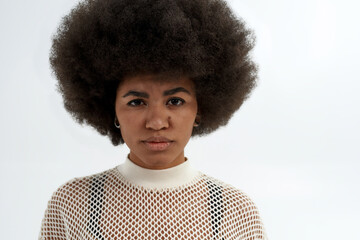 Portrait of serious black woman looking at camera