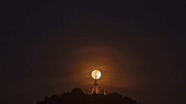 Pagoda Khao Hua Jook, the fullmoon move over Golden pagoda with warm cloud , twilight sky to moon night sky at Chaweng , Koh samui , suratthani , thailand	
