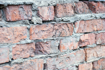 Old brick wall of a village house.