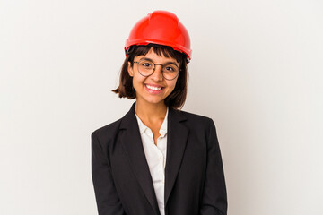Young architect woman with red helmet isolated on white background happy, smiling and cheerful.