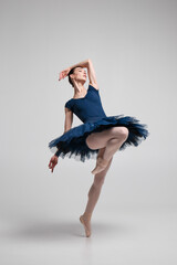 Beautiful ballerina posing in studio.