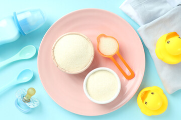Fototapeta na wymiar Concept of baby food with рowdered milk on blue background