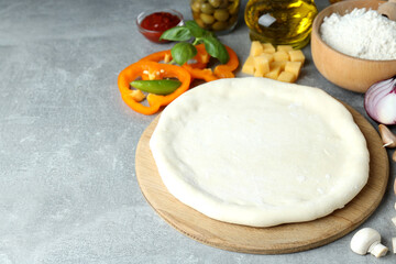 Concept of cooking pizza on gray textured background