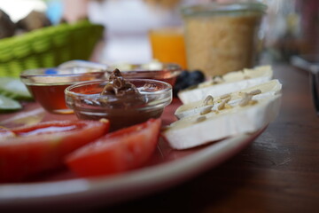 cheese and tomato and breakfast on a plate
