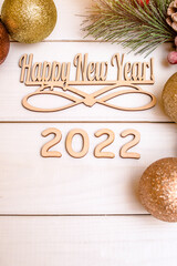 Happy new year 2022 on wooden white background

