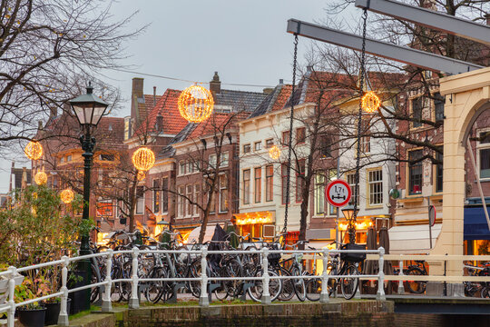 Canal bridge with christmas decoration in the historic city center of the Dutch city of Alkmaar