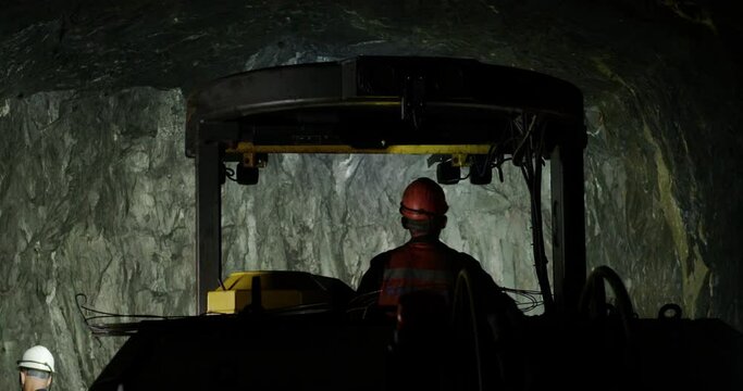 The miner is driving a transport in the mine