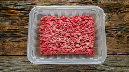 Ground beef in plastick try on table