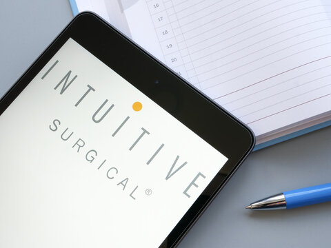 KYIV, UKRAINE - October 21, 2021. Intuitive Surgical Inc Logo Near Pen And Notebook.