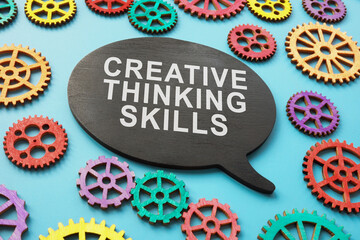 Creative thinking skills phrase and colored gear wheels.