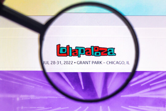 November 22, 2021, Brazil. In this photo illustration, a Lollapalooza logo seen displayed on a computer screen through a magnifying glass.
