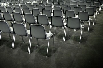 Naklejka premium Gray empty audience seats arranged in rows