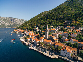 Naklejka na ściany i meble Drone view of the Perast coast with ancient houses and a tower. Montenegro