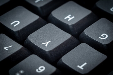 Black keys from a laptop with symbols close-up.