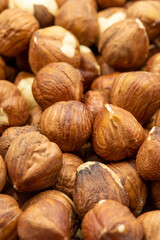 Close-up Peeled hazelnuts. food background. Snack Fresh Nuts. Story format