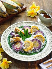Pisang Rai is a traditional Balinese snack. Bananas wrapped in rice flour dough, steamed, covered with grated coconut, brown sugar sauce. Similar to Kue Kacamata, Sanggar Banyu, Mata Roda, Putri Noong