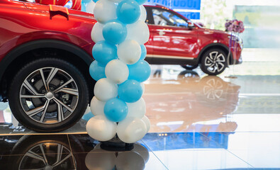 New cars at dealer showroom floors, showrooms for sale at car dealerships.