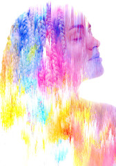 A double exposure portrait of a woman combined with digital art.