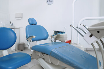 Dentist's office interior with chair and modern equipment
