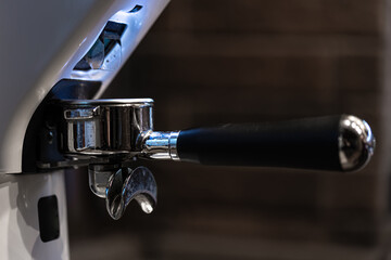 Close-up part of a coffee machine, a holder for coffee.