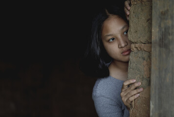 Young girl with eye sad and hopeless. Human trafficking and fear child concept.