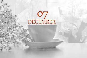 calendar date on light background with porcelain white tea pair and white gypsophila with copy...