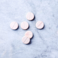 Vitamin effervescent Tablets on bright stone background. Top view. Copy space.	