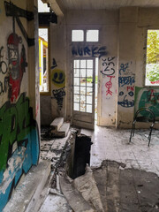 Old dilapidated, abandoned, squatted and tagged building