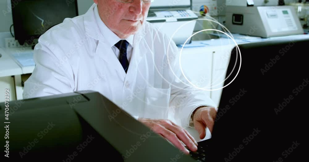 Poster animation of circles spinning over male scientist using computer