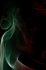 Abstract colorful smoke swirls on black background