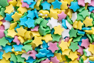 Fototapeta na wymiar Colorful Sugar Star Sprinkles Background.