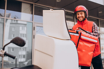 Food delivery boy delivering food on scooter © Petro