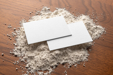 Blank business cards on the hay, farm bakery branding mockup, empty space to display your logo or...