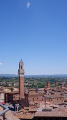 Panorama of Piazza del Campo (Campo square), Palazzo Publico and Torre del Mangia (Mangia tower) in Siena, Tuscany, Italy 