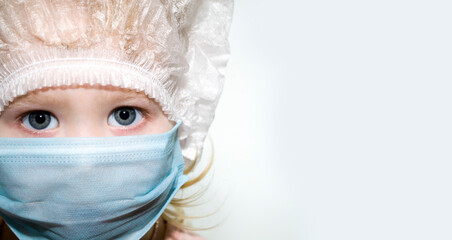 A girl in a medical mask on a white background.