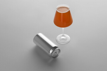 Blank beer can and glass with beer on a white background, craft beer mockup templates, with empty...