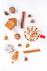 Christmas composition of toys, cones and cocoa mugs with marshmallows on a white background. Flat lay, top view