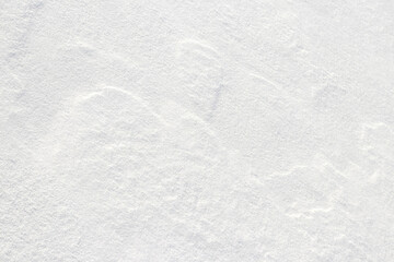 Obraz premium Snow texture, white snow surface after blizzard and strong wind