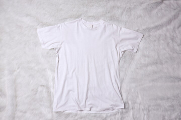 White t-shirt mockup on grey background. Flat lay tee template